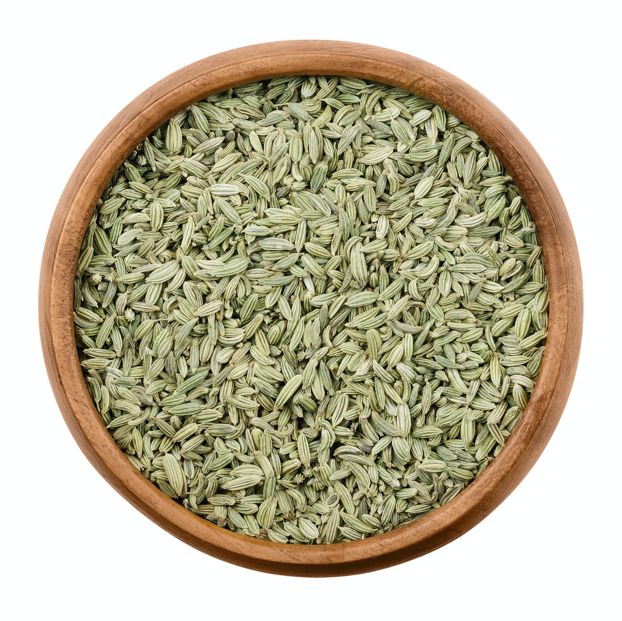 Fennel seeds in a wooden bowl over white